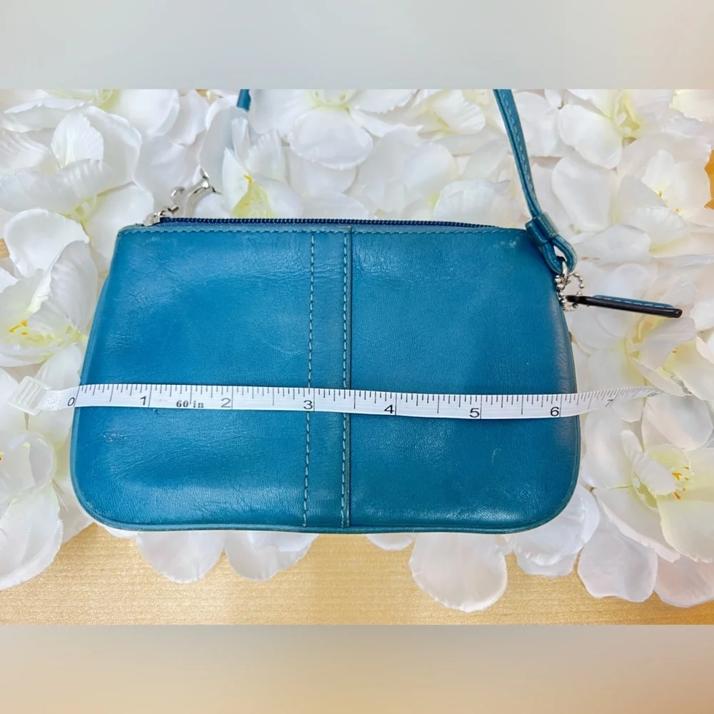 Coach Legacy Leather Small Wristlet. design is featured during Coach’s 65th